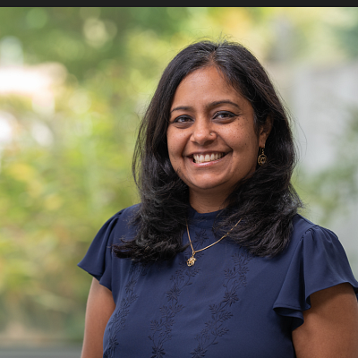 Headshot of Monica Malhotra, smiling