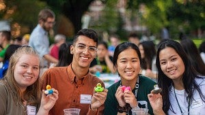Four PathwayOregon students holding rubber ducks